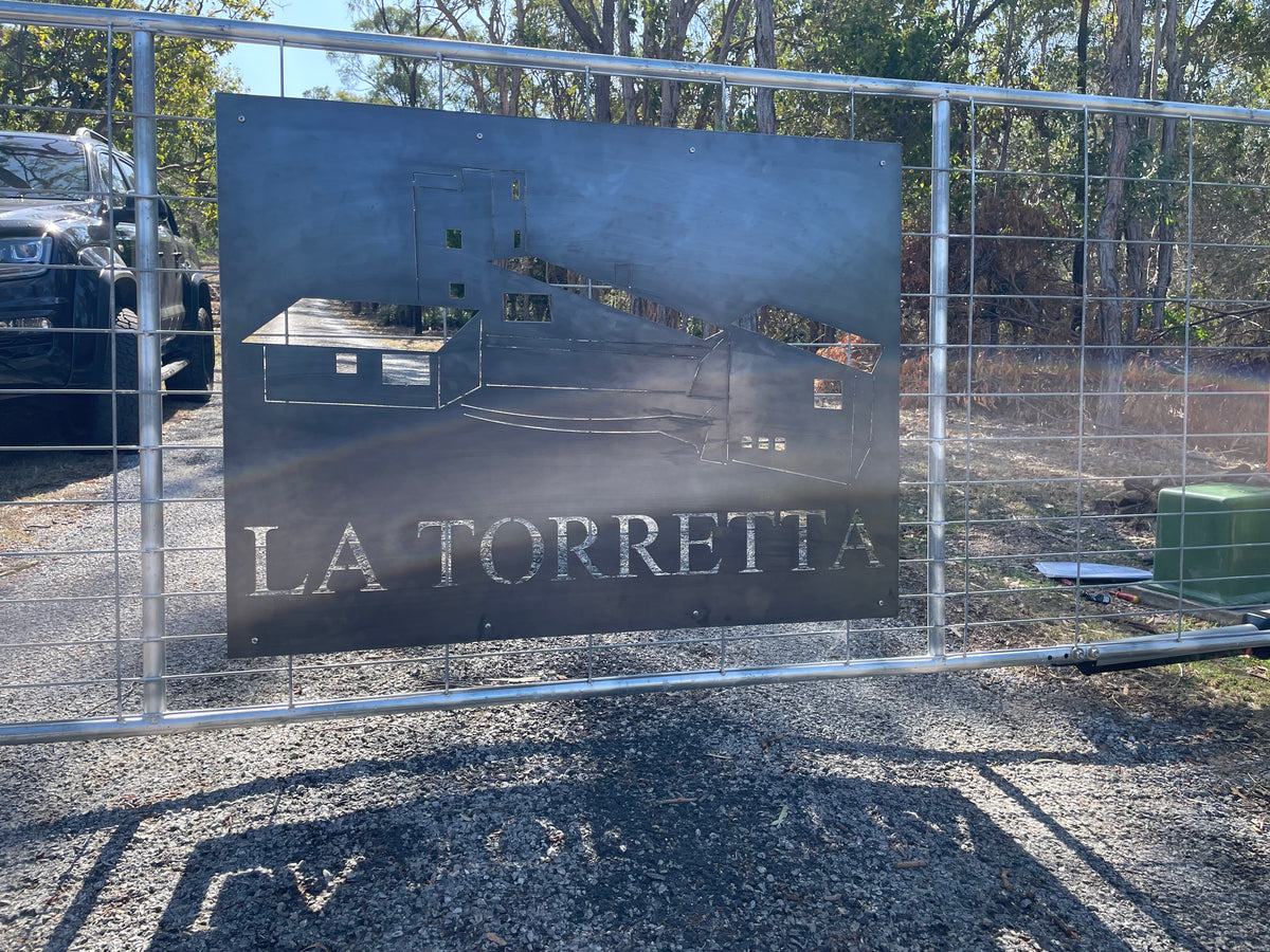 Metal sign with 'La Torretta' Property Gate Sign.