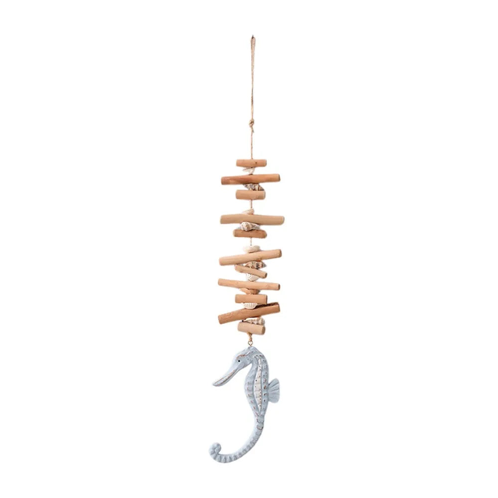 Decorative hanging with stacked wooden planks and a seahorse charm on a white background