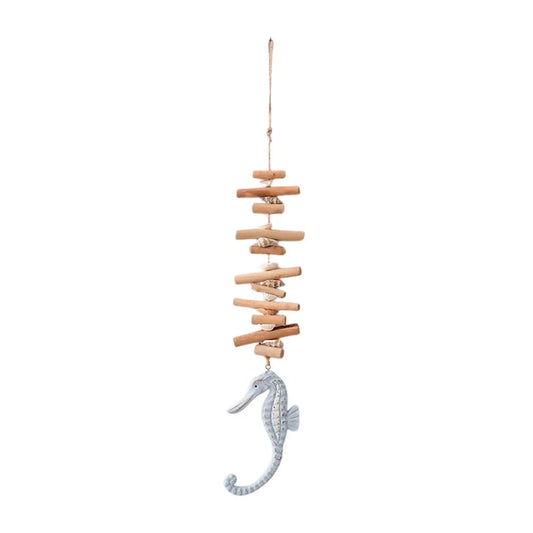 Decorative hanging with stacked wooden planks and a seahorse charm on a white background