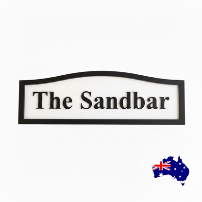 Decorative sign with 'The Sandbar' text 