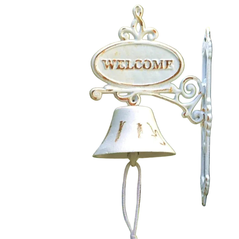 A distressed white metal garden bell with a 'WELCOME' sign on top