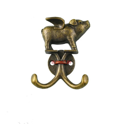 Two antique bronze pig-shaped wall hooks with wings, shown on a plain white background with a yellow '2PCS' text overlay in the top left.