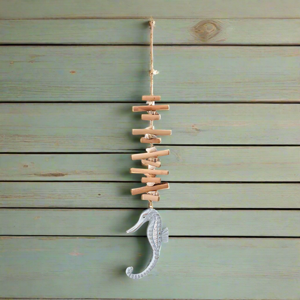 Decorative wall hanging with seahorse design on a wooden background