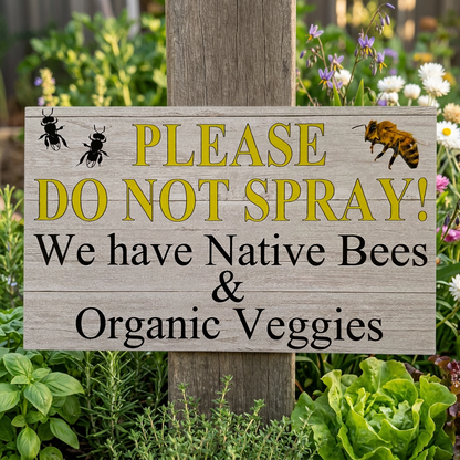 Bee sign plaque beside a veggie patch
