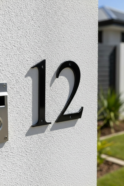 Black 12 on rendered pillar
