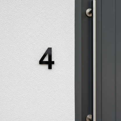 Black number 4 on rendered wall