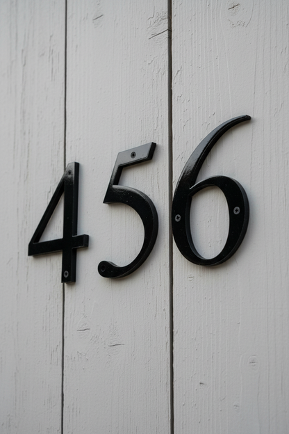Black numbers on fence