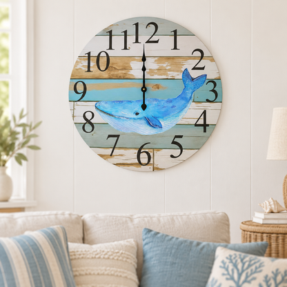 Blue whale coastal wall clock above a linen sofa with coastal cushions