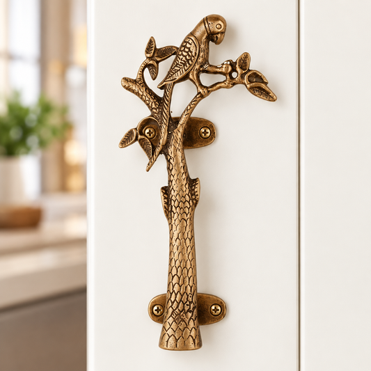 Brass parrot handle on a modern cabinet
