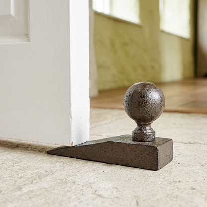 Classic ball wedge doorstop in cottage hallway