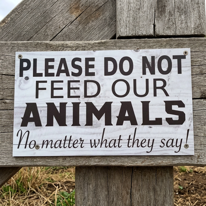 Do Not Feed Our Animals sign on a farm gate