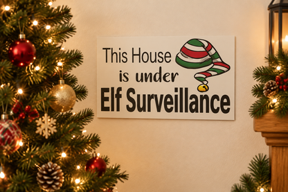 Elf Surveillance sign beside a decorated Christmas tree