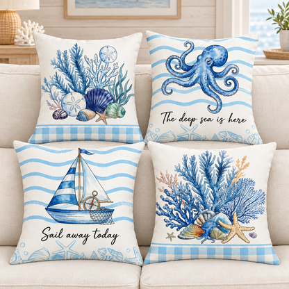 Four coastal cushions styled on a cream sofa