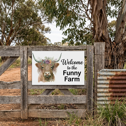 Funny Farm Highland cow sign on a rural timber gate
