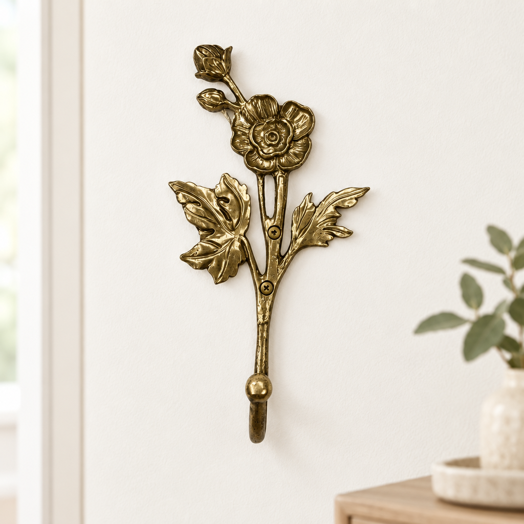 Gold floral wall hook in a modern entryway