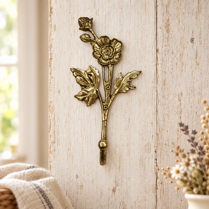 Gold floral wall hook on rustic cottage timber