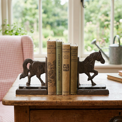 Horse bookends in a country cottage study