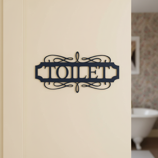Toilet — deep charcoal navy painted MDF vintage scroll sign on a flat cream surface — painted DIY toilet door décor