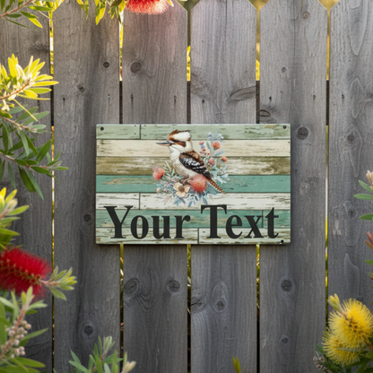 Kookaburra Your Text weathered timber sign on a timber garden fence with bottlebrush