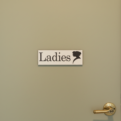 Ladies black and white sign with lady silhouette on a closed sage cafe door