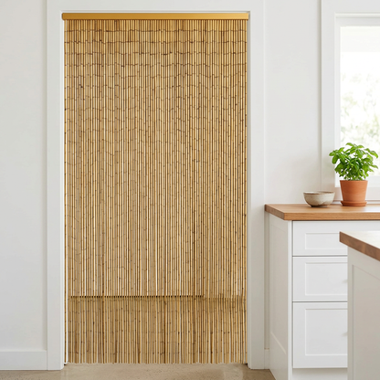 Natural bamboo curtain in a bright coastal kitchen doorway