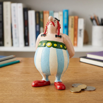 Obelix money box displayed on an oak desk