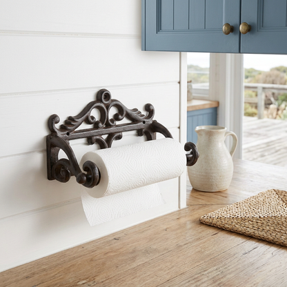 Paper towel holder in a coastal kitchen with white shiplap and sandy timber
