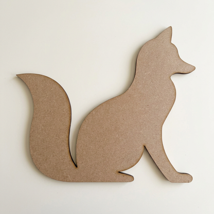 Raw MDF sitting fox on a plain table