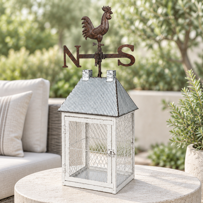 Rooster lantern cage on a modern patio