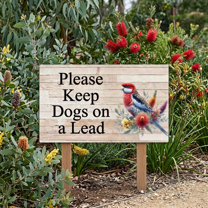 Rosella dogs-on-lead sign on two stakes beside a native garden path