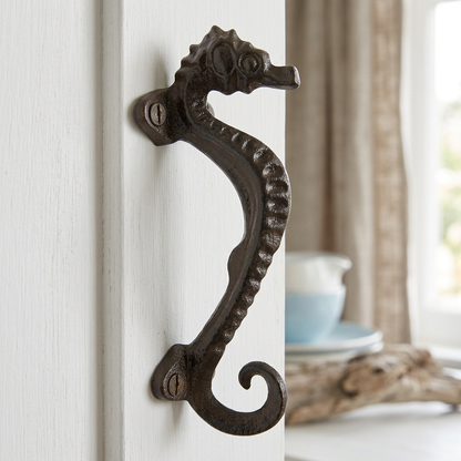 Seahorse handle on a white coastal cabinet