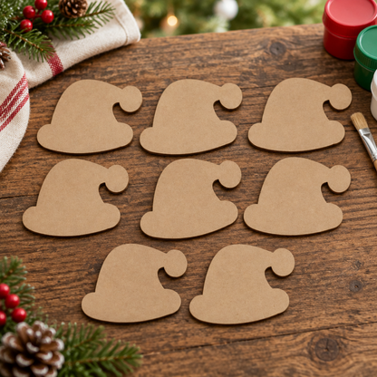 Set of eight Santa hat MDF blanks on a rustic craft table