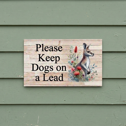 Square-corner kangaroo sign on cottage weatherboards