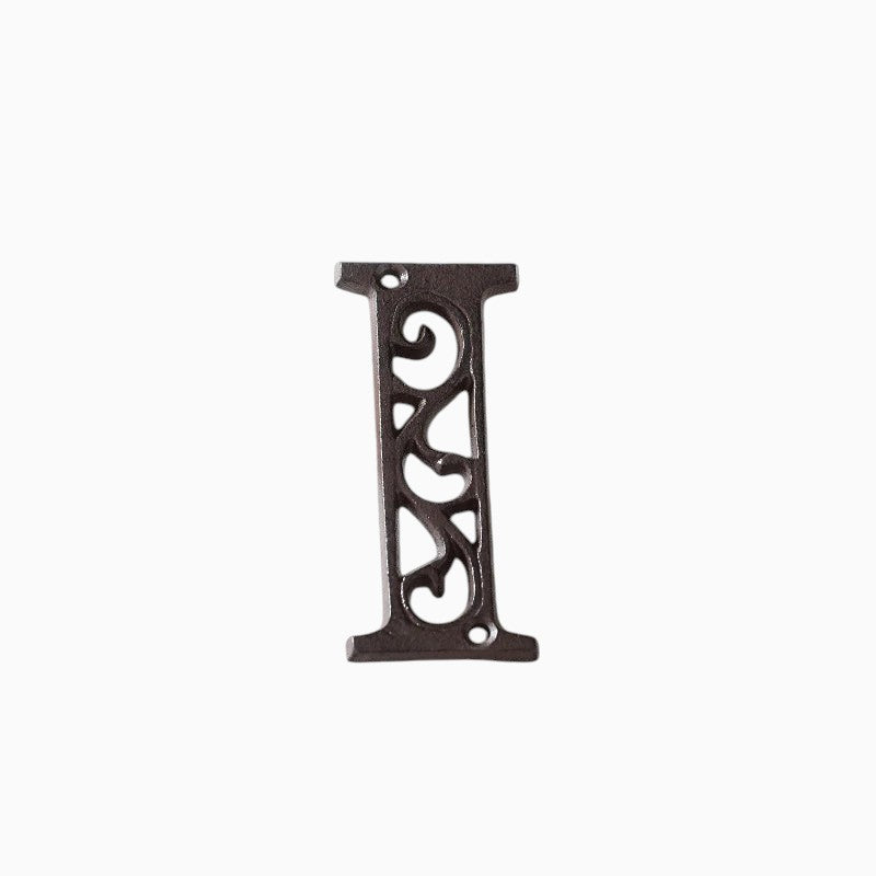 The Renmy Store Homewares & Gifts black lacquered cast iron letter I with a decorative hollowed-out vintage design.