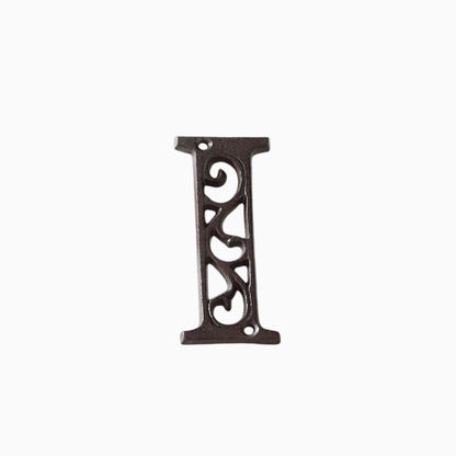 The Renmy Store Homewares & Gifts black lacquered cast iron letter I with a decorative hollowed-out vintage design.