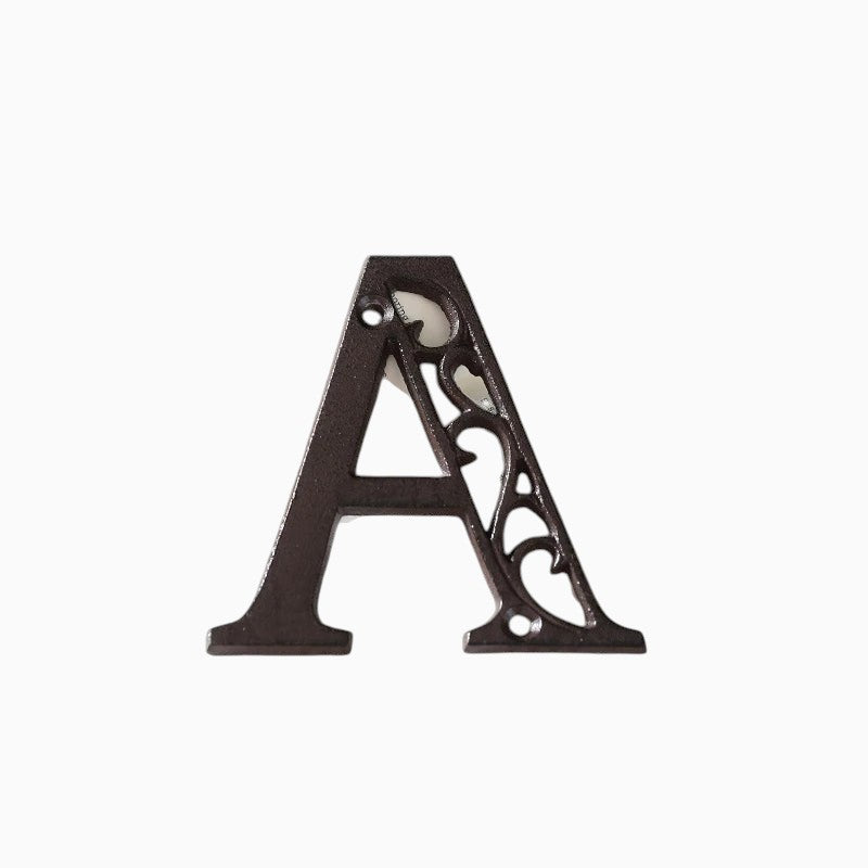 The Renmy Store Homewares & Gifts black lacquered cast iron letter A with a decorative hollowed-out vintage design.