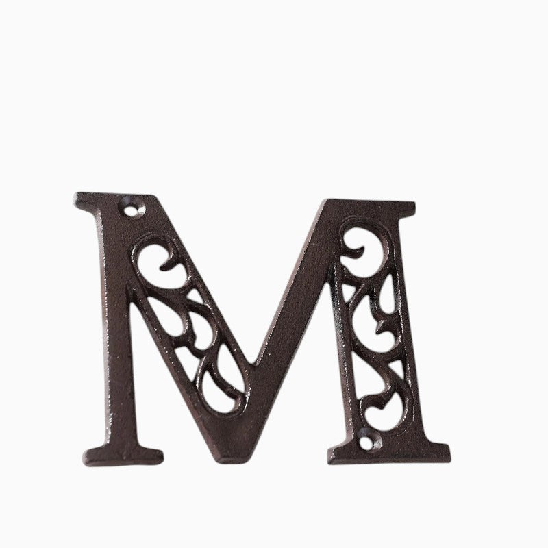 The Renmy Store Homewares & Gifts black cast iron letter M with a decorative hollowed-out vintage European design.