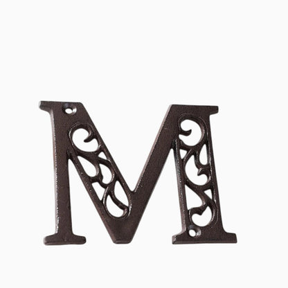 The Renmy Store Homewares & Gifts black cast iron letter M with a decorative hollowed-out vintage European design.