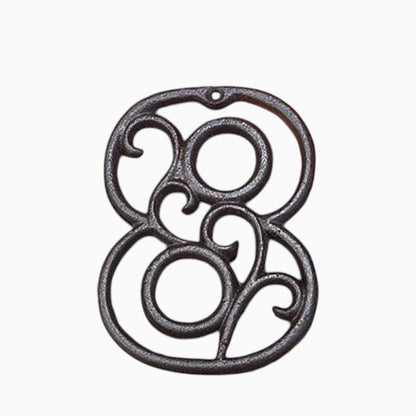 The Renmy Store Homewares & Gifts black lacquered cast iron number 8 with a decorative 3D hollowed-out retro design.