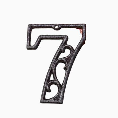 The Renmy Store Homewares & Gifts black lacquered cast iron number 7 with a decorative 3D hollowed-out retro design.