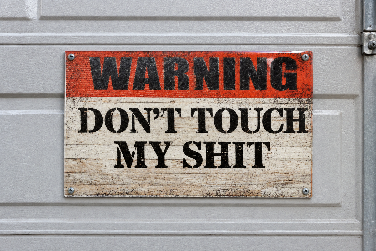 Vintage warning sign on a garage door