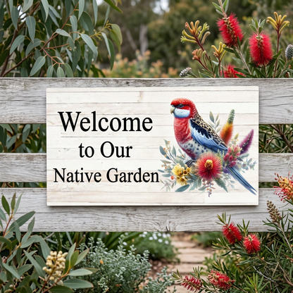 Welcome to Our Native Garden rosella sign on a garden fence