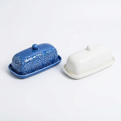 White and blue botanical butter dishes on white, without branding