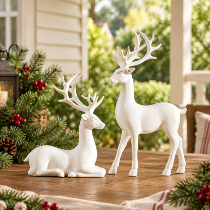 White reindeer pair on a festive cottage verandah table