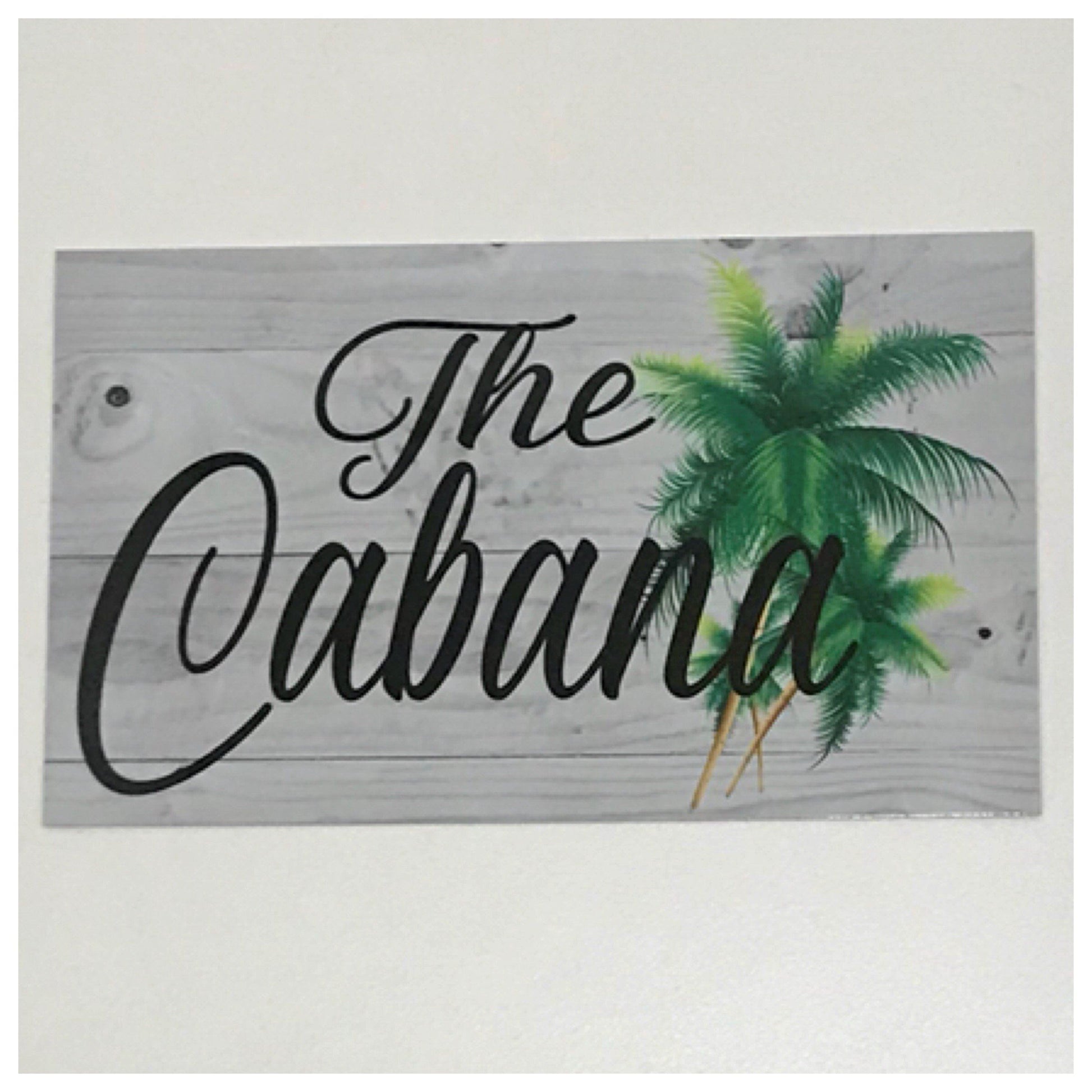 The Cabana with Palm Trees Sign