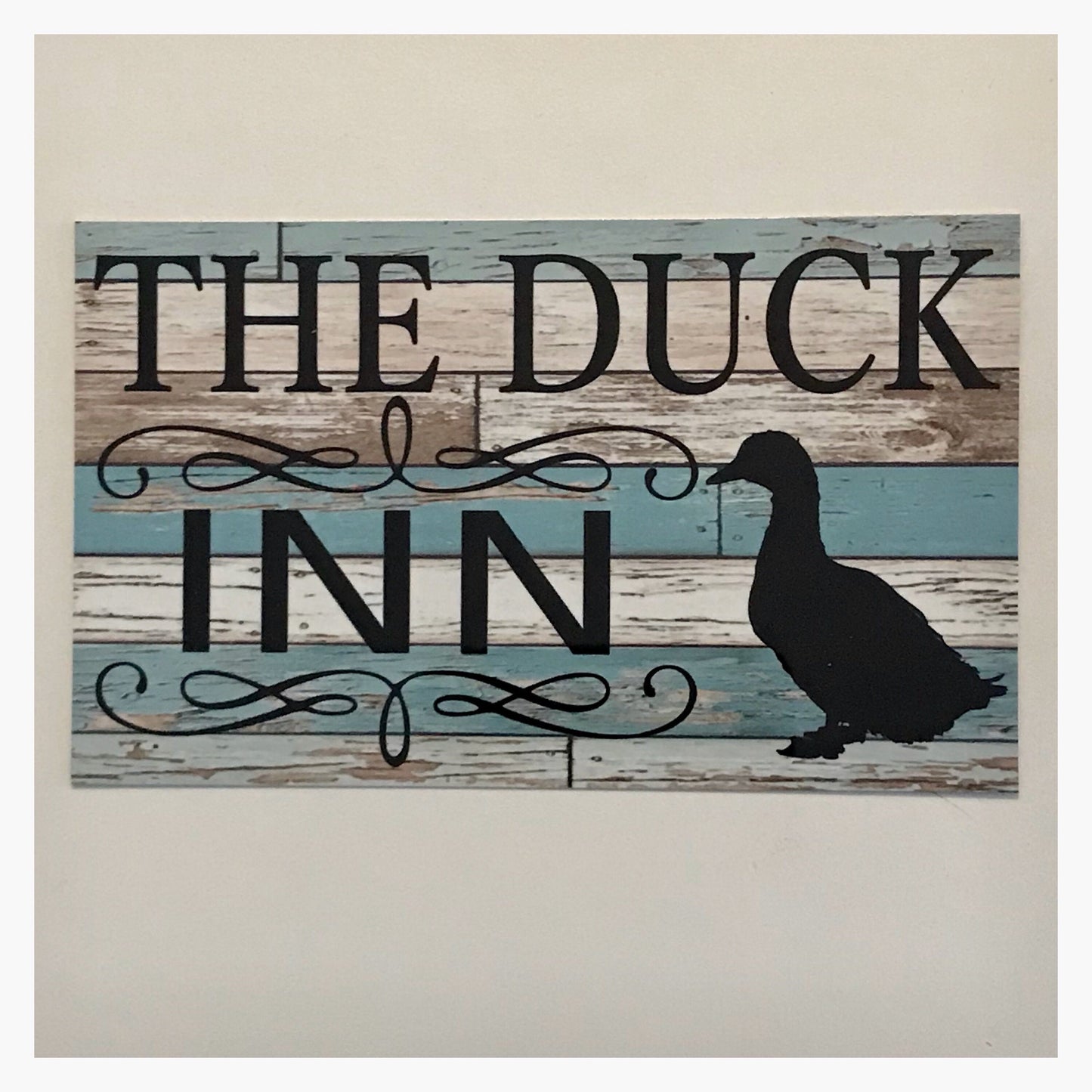 The Duck Inn Blue Sign